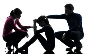 parents in relationship counseling with an unruly teenager